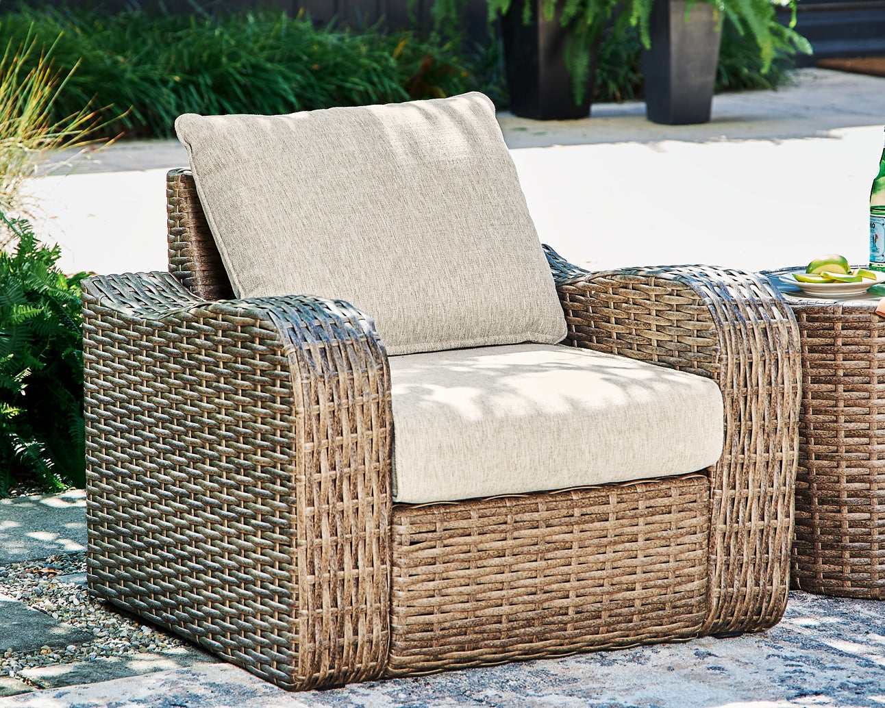 Ashley Express - Sandy Bloom Outdoor Lounge Chair and Ottoman